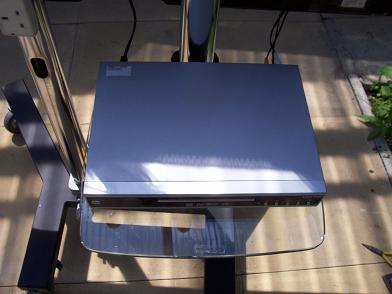 TV Hire picture showing a DVD Player on the trolley stands glass shelf.
